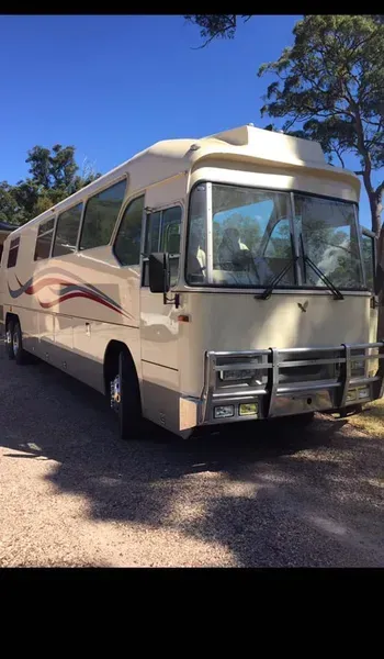 A Beige Motorhome Parked on a Gravel Surface Outdoors — Mid North Coast Heavy Vehicle Repairs In Wauchope, NSW