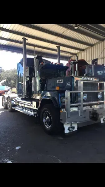 A Dark Blue Semi-truck With a Silver Bull Bar — Mid North Coast Heavy Vehicle Repairs In Wauchope, NSW
