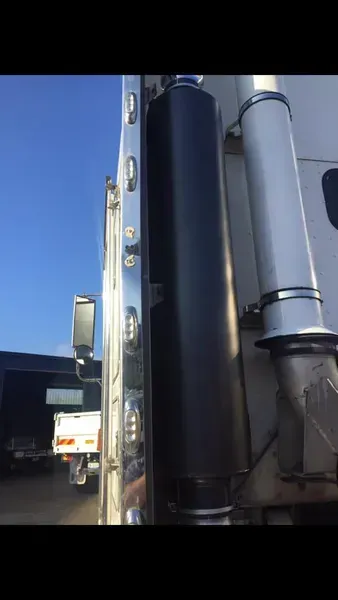 A Cylindrical Exhaust Muffler Mounted on the Side of a Truck Cab — Mid North Coast Heavy Vehicle Repairs In Wauchope, NSW