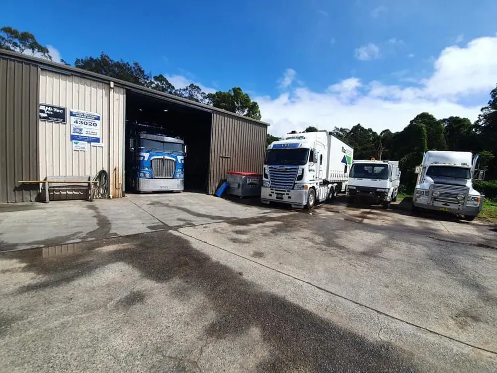 A Blue Semi-truck is Parked Inside a Garage — Mid North Coast Heavy Vehicle Repairs In Kew, NSW