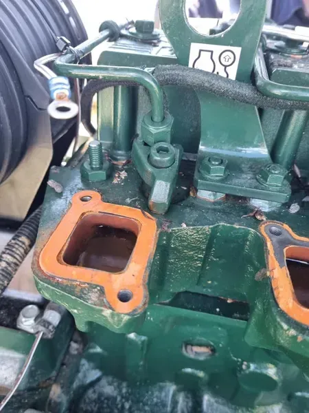 Close-up of a Green Internal Combustion Engine Head — Mid North Coast Heavy Vehicle Repairs In Wauchope, NSW