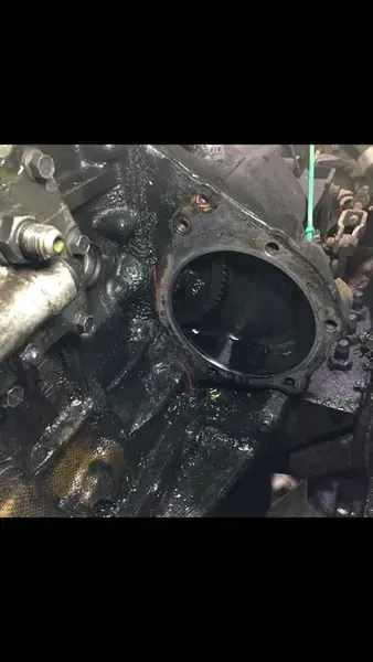 An Open Gear Housing on a Greasy, Dark Mechanical Engine Block — Mid North Coast Heavy Vehicle Repairs In Wauchope, NSW