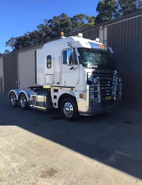 A Semi-truck With a Chrome Bull Bar Parked Outside — Mid North Coast Heavy Vehicle Repairs In Wauchope, NSW