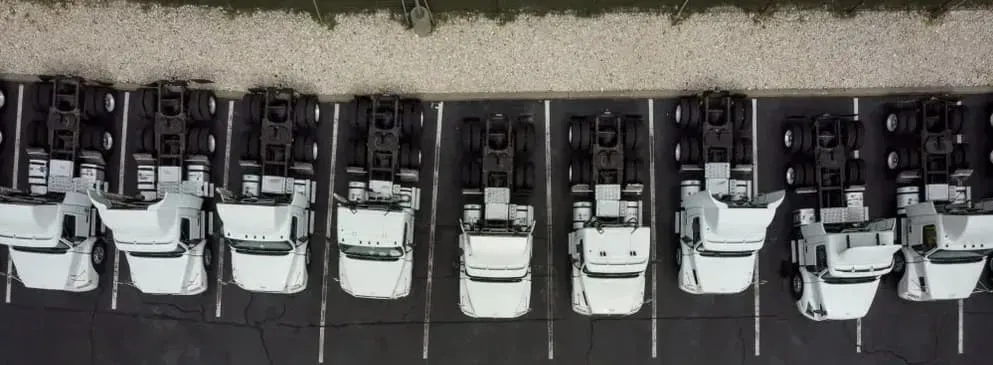 An Aerial View of a Row of White Semi-truck Cabs Parked — Mid North Coast Heavy Vehicle Repairs In Wauchope, NSW