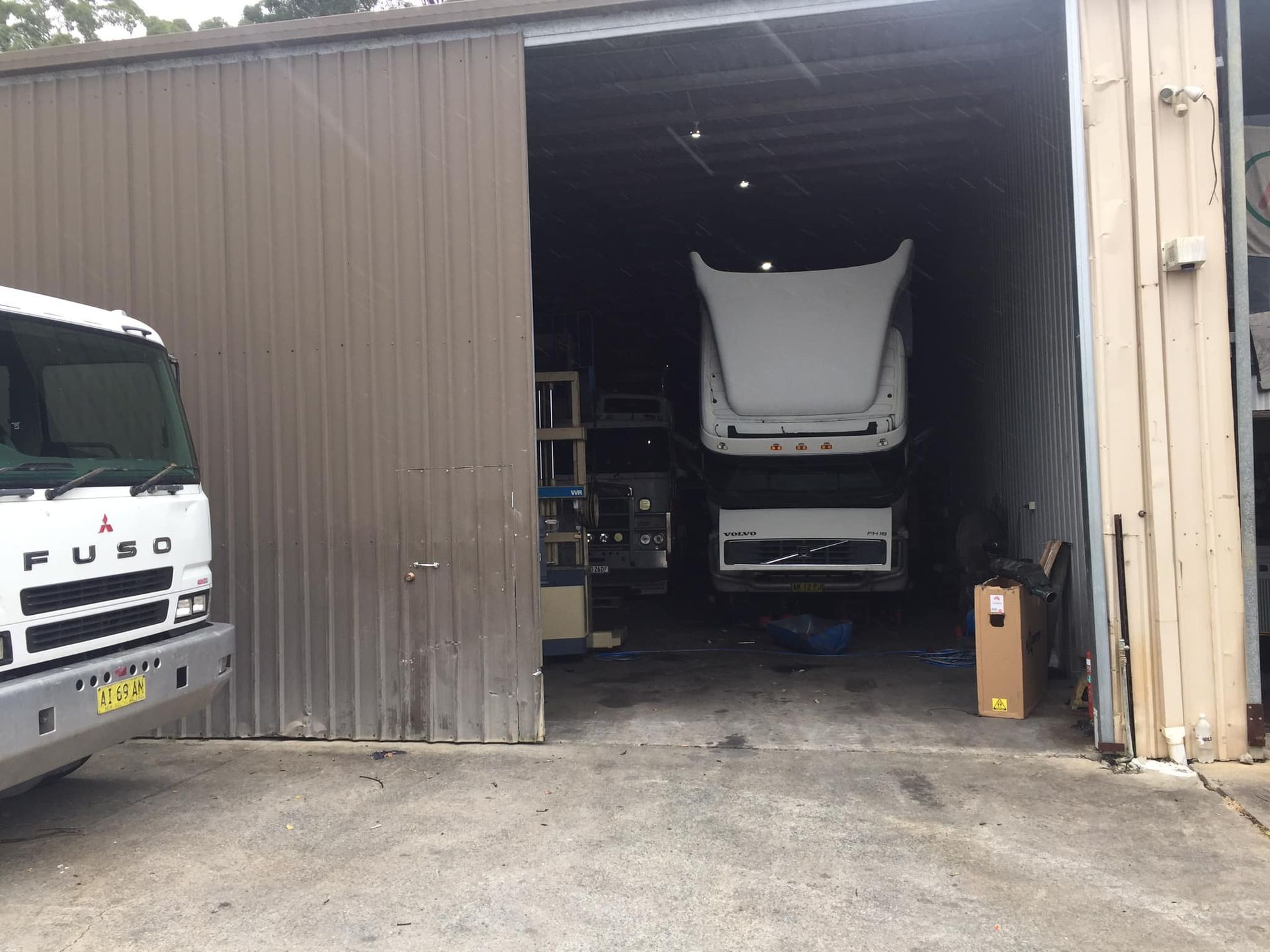 A Fuso Truck Parked Outside a Garage Bay — Mid North Coast Heavy Vehicle Repairs In Lake Cathie, NSW