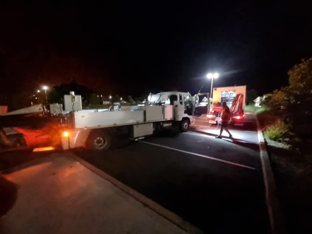 A Utility Truck Parked in a Lit Parking Lot at Night — Mid North Coast Heavy Vehicle Repairs In Laurieton, NSW
