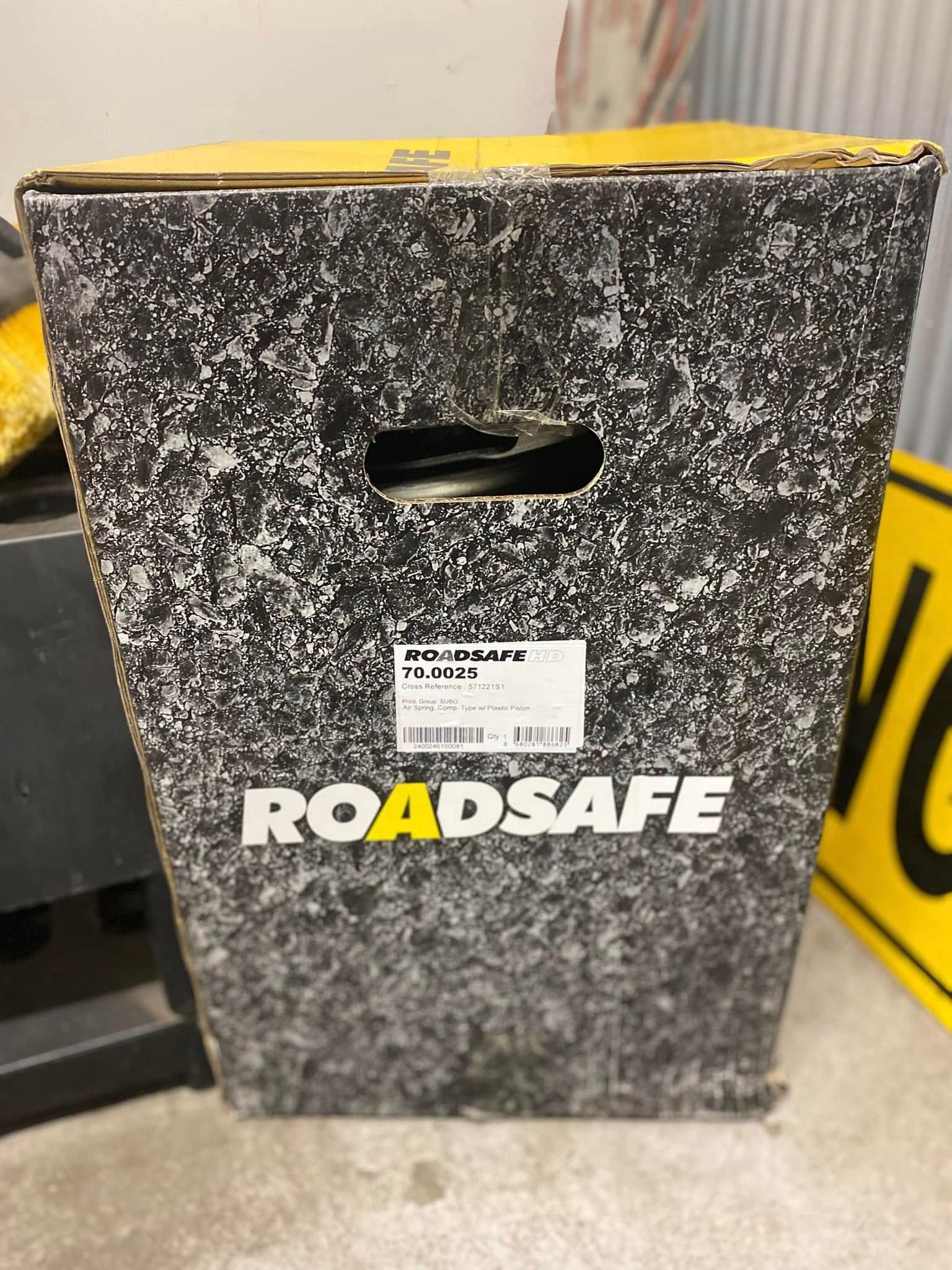 A Tall, Black-and-grey Mottled Cardboard Box With the Roadsafe Logo — Mid North Coast Heavy Vehicle Repairs In Wauchope, NSW