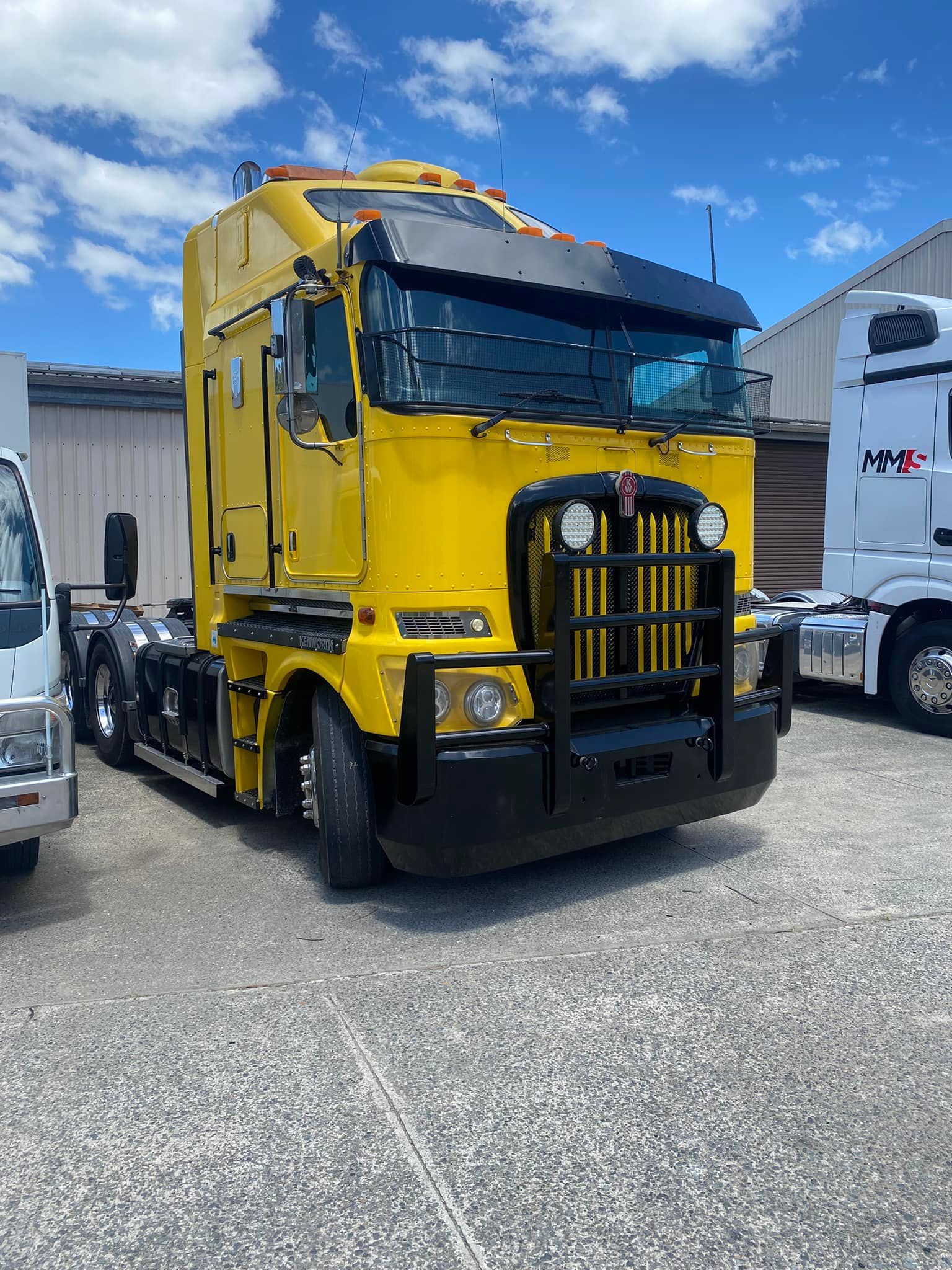 A Bright Yellow Kenworth Cab-over Semi-truck — Mid North Coast Heavy Vehicle Repairs In Wauchope, NSW