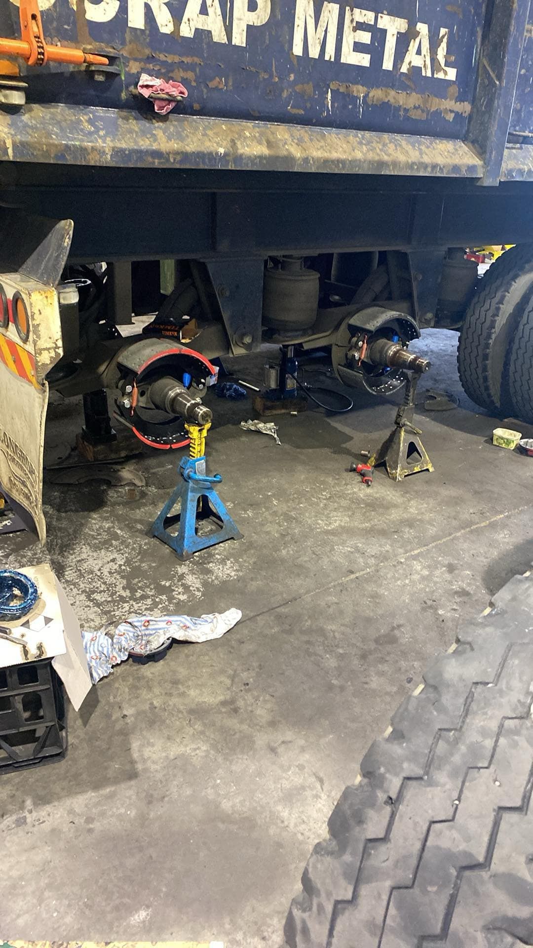 A Blue Scrap Metal Truck Trailer Supported by Two Blue Jack — Mid North Coast Heavy Vehicle Repairs In Wauchope, NSW