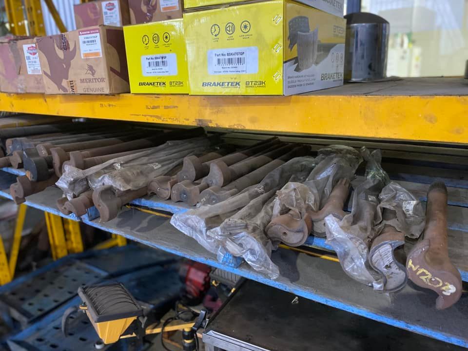 Yellow Storage Rack Holding Boxes of Auto Parts — Mid North Coast Heavy Vehicle Repairs In Wauchope, NSW
