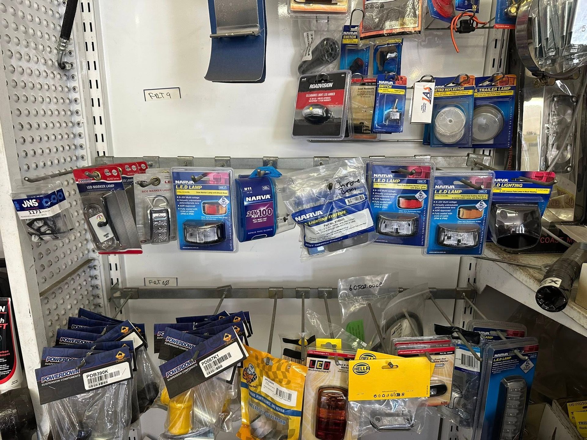 A Shelf Filled With Various Automotive Lighting Products — Mid North Coast Heavy Vehicle Repairs In Wauchope, NSW