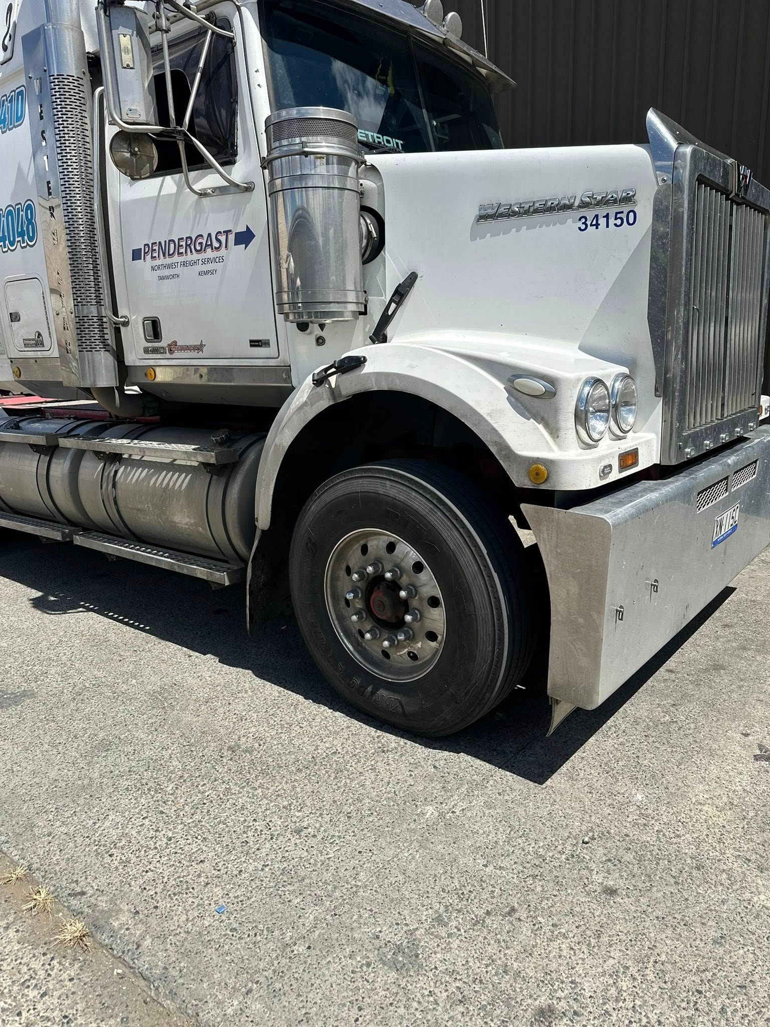A White Kenworth Semi-truck Parked on a Gravel Surface — Mid North Coast Heavy Vehicle Repairs In Wauchope, NSW