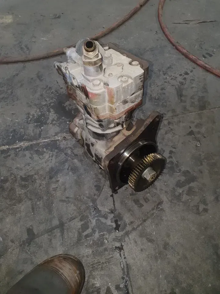 A Heavy-duty Gear-driven Air Compressor Unit Sitting on a Dark — Mid North Coast Heavy Vehicle Repairs In Wauchope, NSW