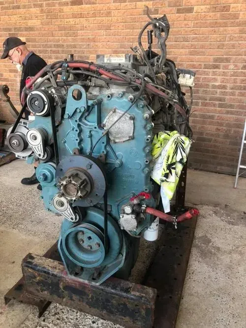 A Large Teal Industrial Diesel Engine Sitting on a Metal Stand — Mid North Coast Heavy Vehicle Repairs In Wauchope, NSW