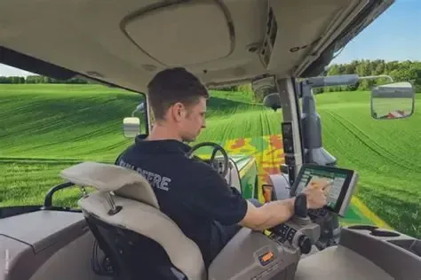 Two farmers examining seeds with a magnifying glass and clipboard in a field.