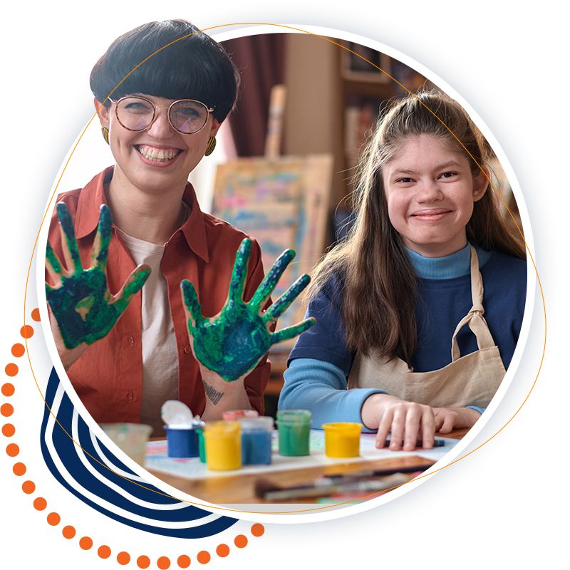 a woman and a girl hand painting