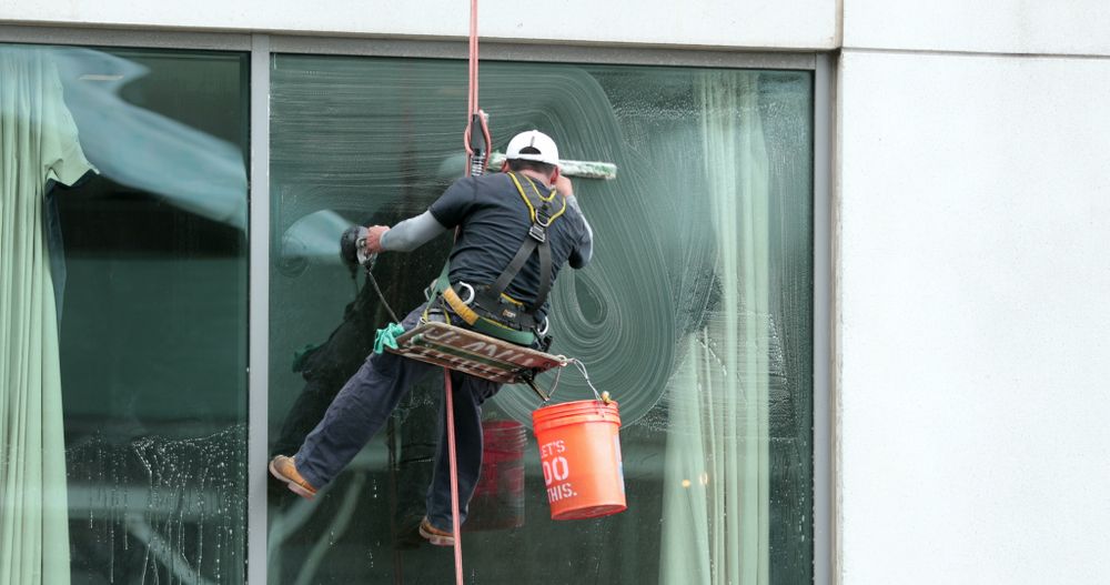 A Man Cleaning A Window — Wyong Commercial Cleaning In Gosford, NSW
