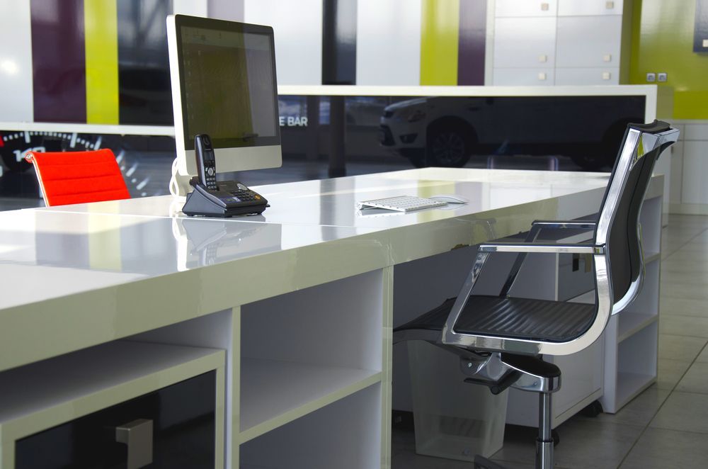 A Desk With A Computer And A Chair In An Office — Wyong Commercial Cleaning In Wyongah, NSW