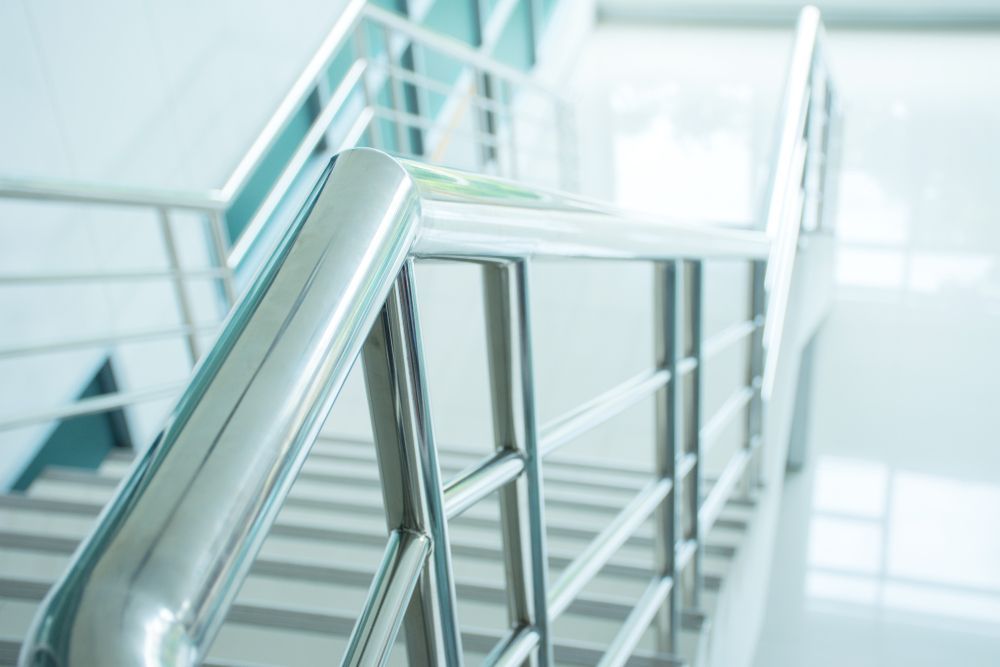 A Close Up Of A Metal Railing On A Set Of Stairs — Wyong Commercial Cleaning In Berkeley Vale, NSW