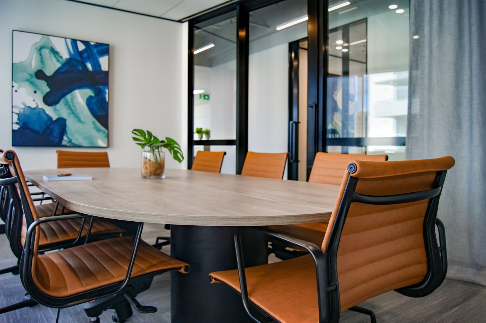 A Conference Room With A Table And Chairs And A Painting On The Wall — Wyong Commercial Cleaning In Wyongah, NSW