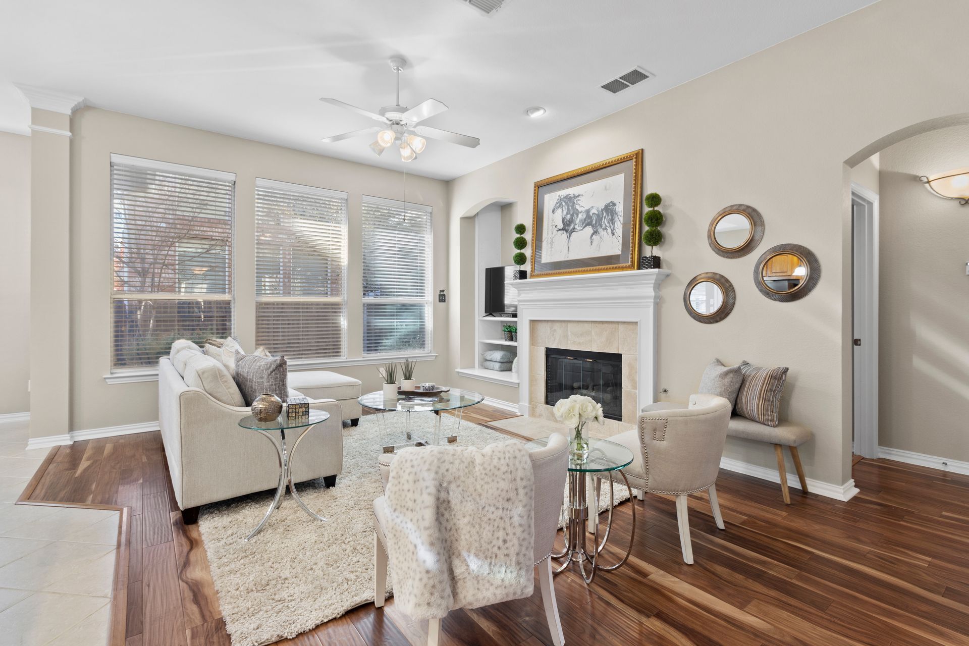 A living room filled with furniture and a fireplace.