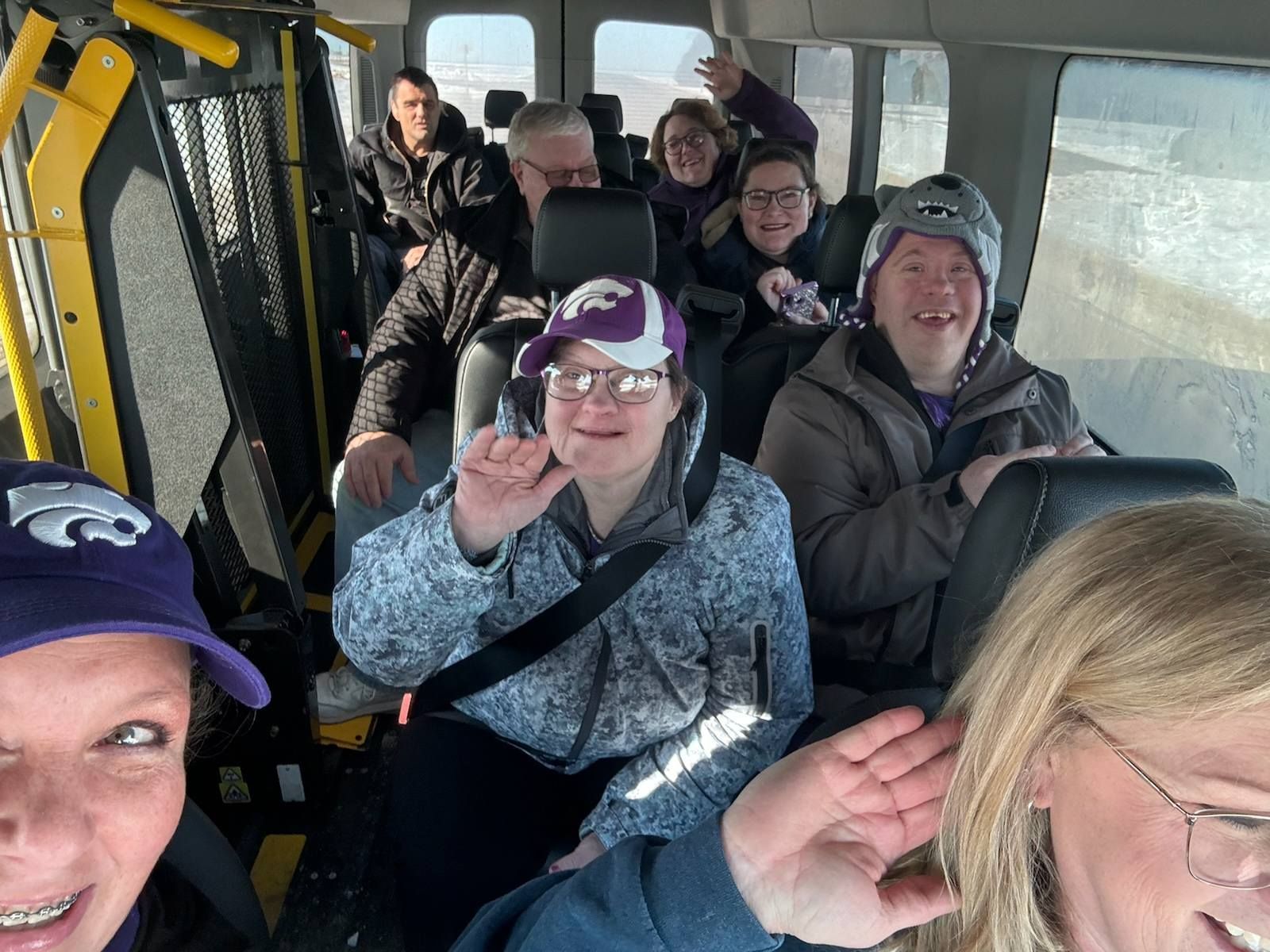 A group of people are sitting on a bus.