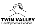 The logo for twin valley developmental services shows two hands holding each other.