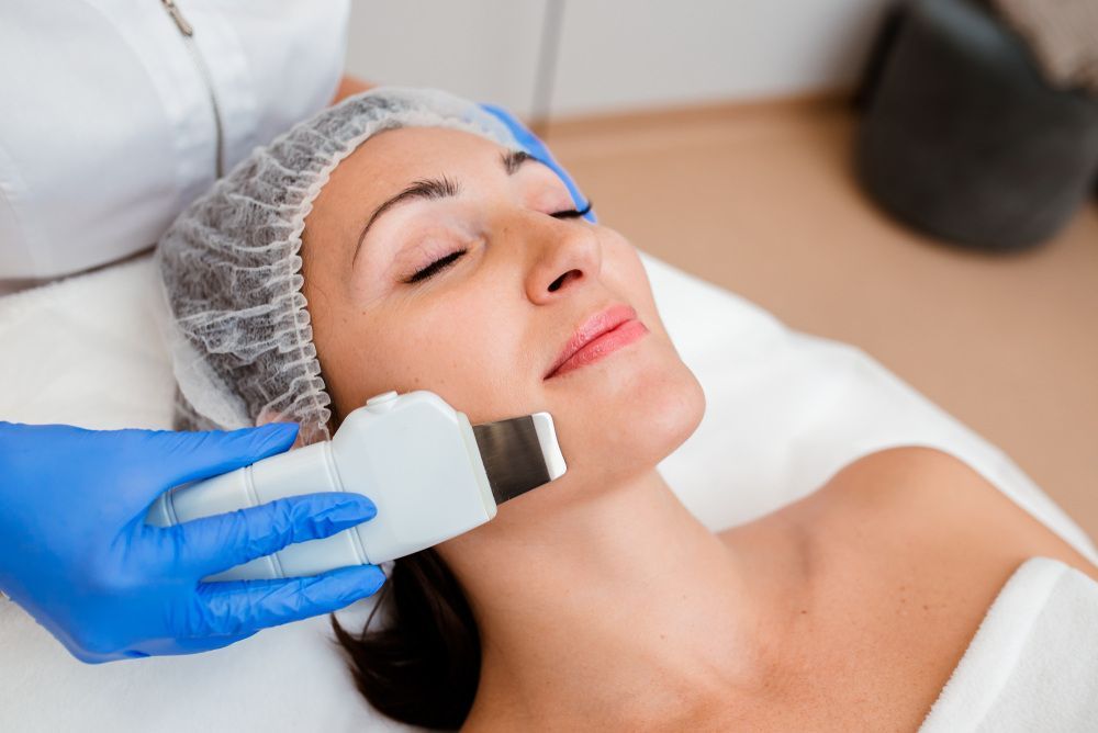 A Woman is Getting an Ultrasound Treatment on Her Face — Coastal Skin & Laser in Maroochydore, QLD