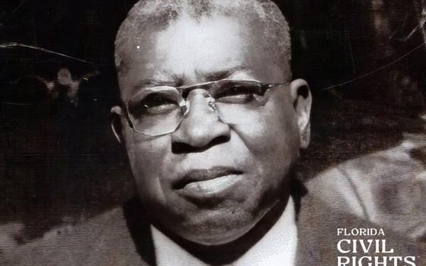 Man in glasses, headshot, likely from the civil rights era.