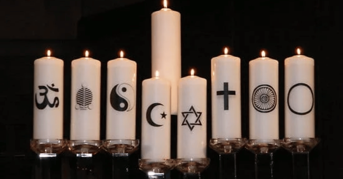 International Funeral Service Southview Trenton NJ - Seven lit candles with different religious symbols on them.