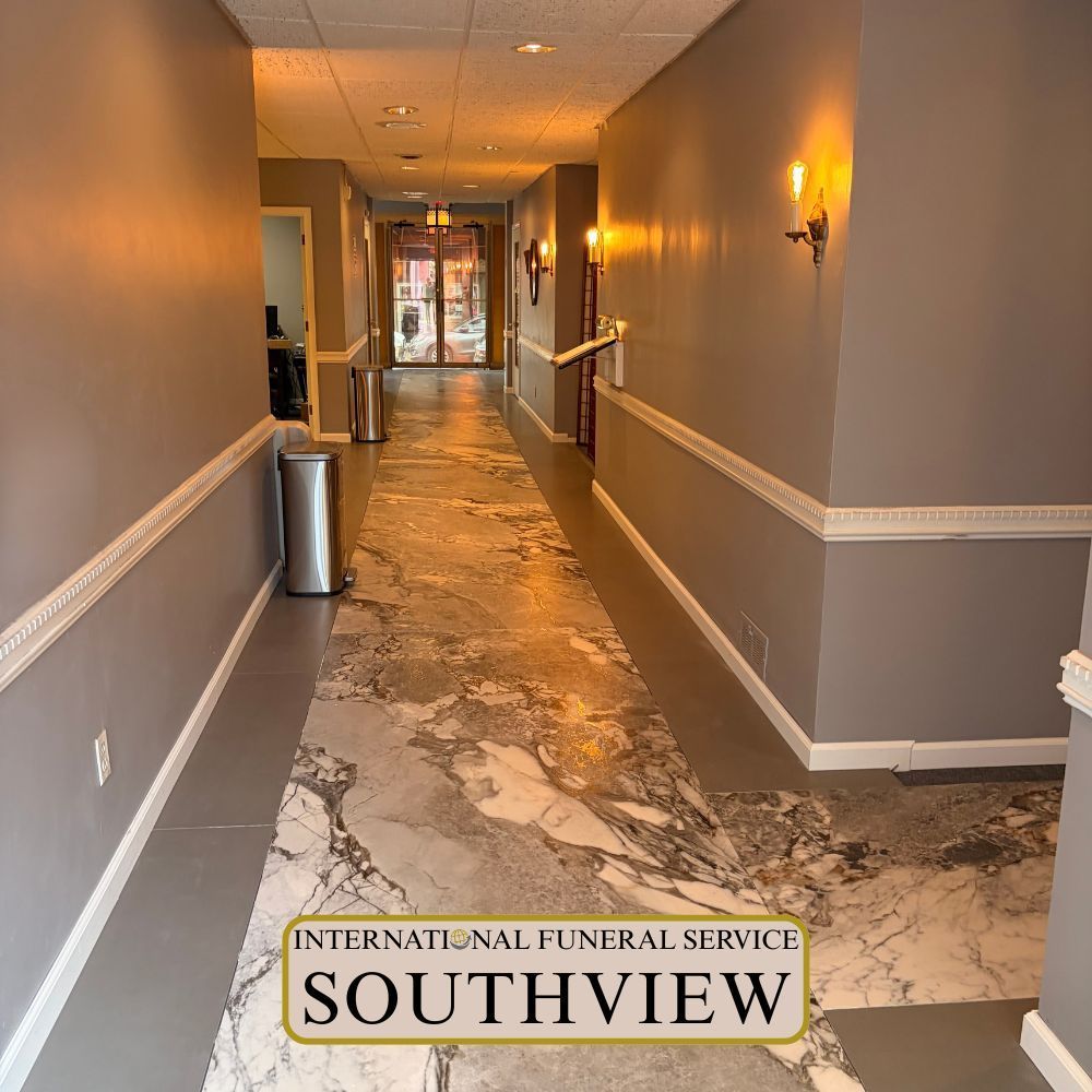 International Funeral Service Southview Trenton NJ - Hallway in a funeral home with gray walls, warm lights.