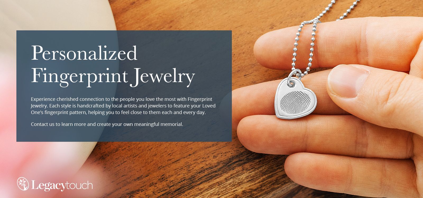 Personalized fingerprint jewelry ad with silver heart pendant on a chain in a hand