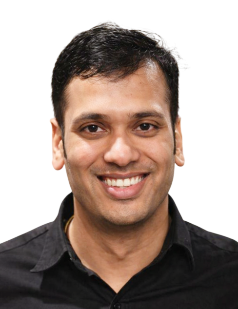 Smiling man in a black shirt against a plain white background