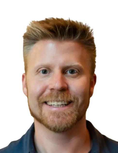 Smiling man with short blond hair and beard on a white background