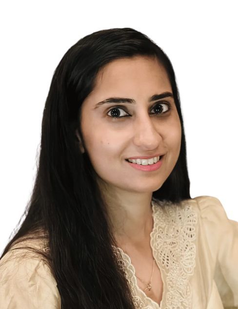 Smiling woman with long dark hair in a beige top against a white background