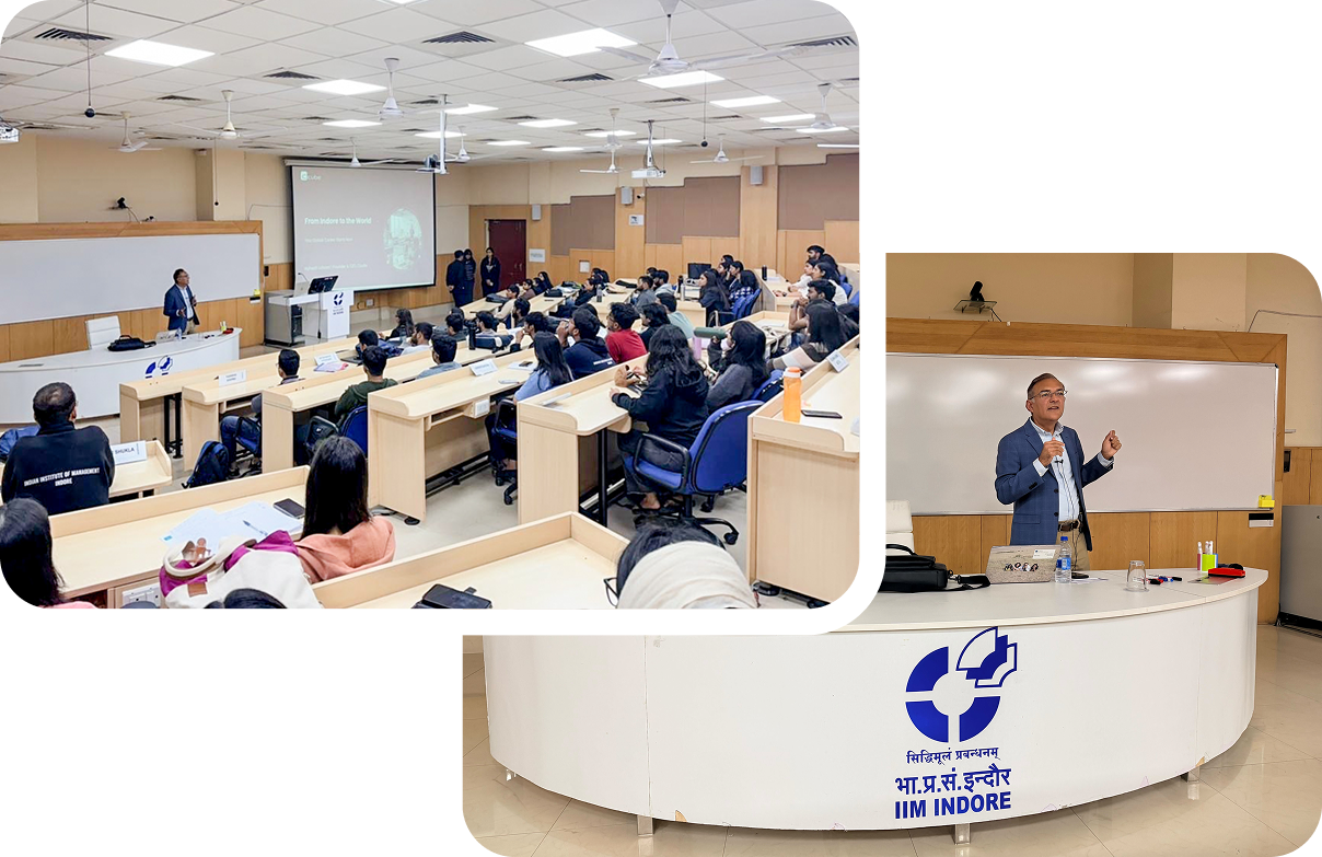 Conference room with seated audience and a speaker at the front behind a white podium