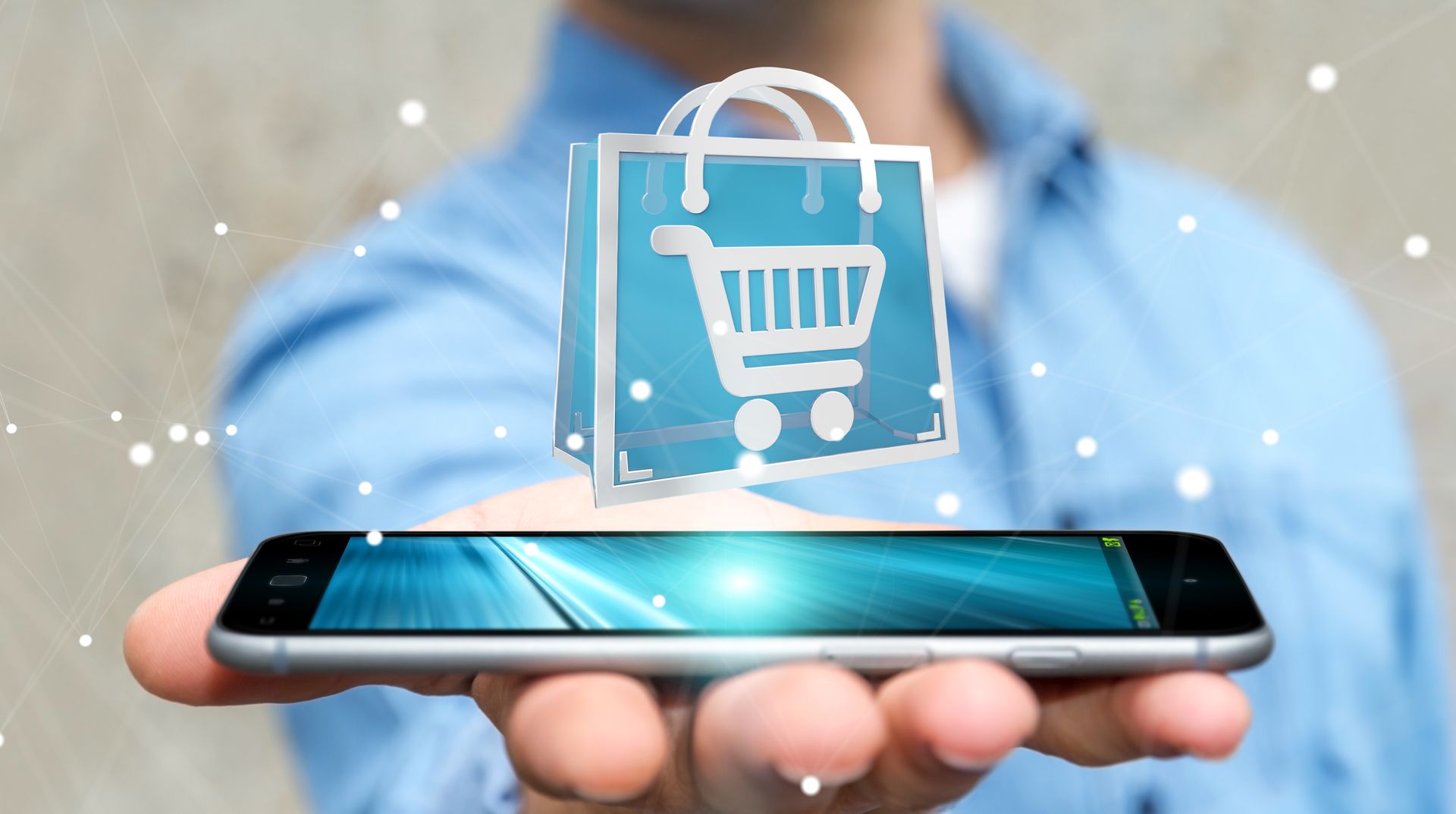 Hand holding a smartphone with a shopping cart icon, suggesting online shopping.