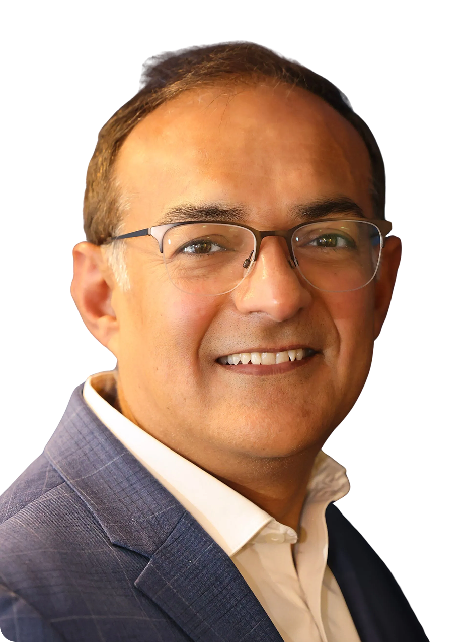 CEO Ccube Mahesh Lalwani - Smiling man in glasses and a blue blazer against a white background