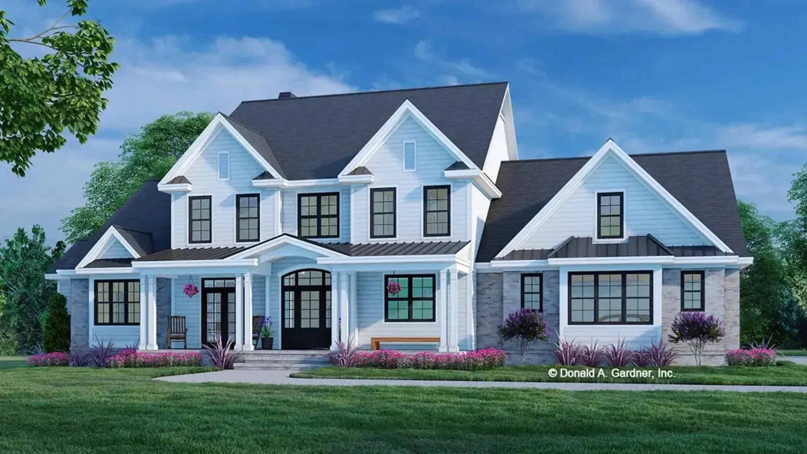 Two-story white farmhouse with a dark gray roof, a covered porch, and a lawn.