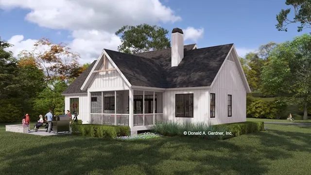 White farmhouse with porch and dark roof, backyard with people.