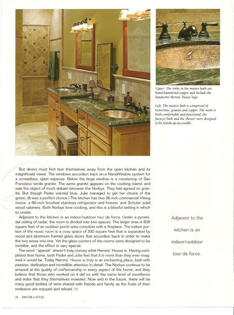 Magazine page showing a beige bathroom with vanity, mirror, sink, and a tiled shower inset.