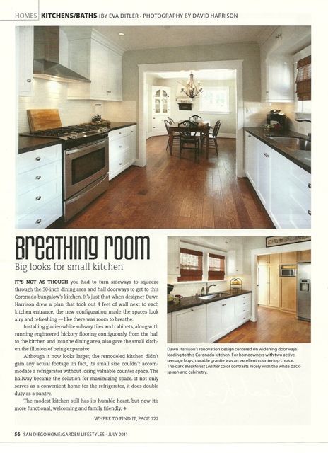 Magazine page featuring a bright white kitchen with hardwood floors and a dining area