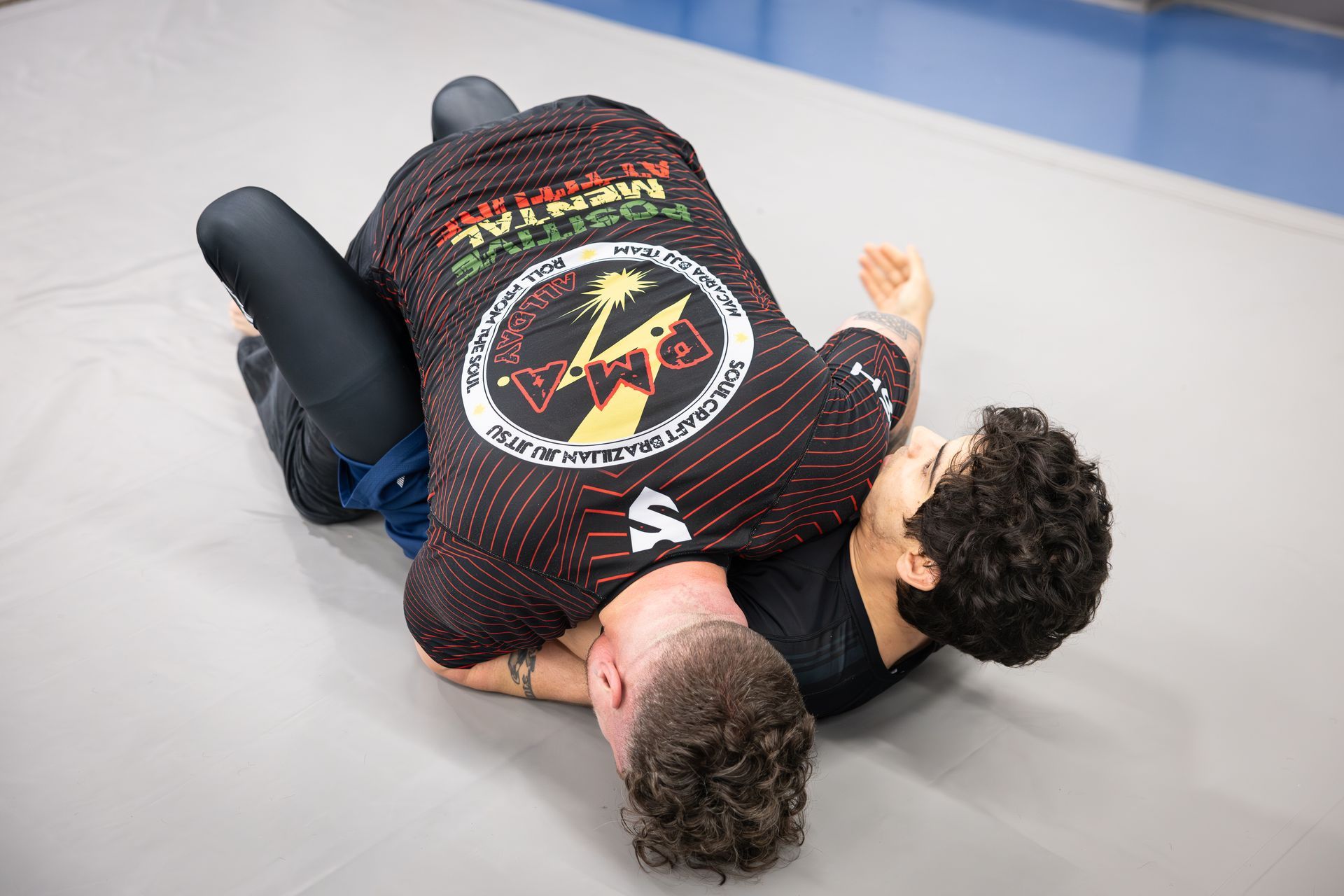 Adults practicing grappling drills at Soulcraft Martial Arts in Hamden, CT, building fitness and stress relief.