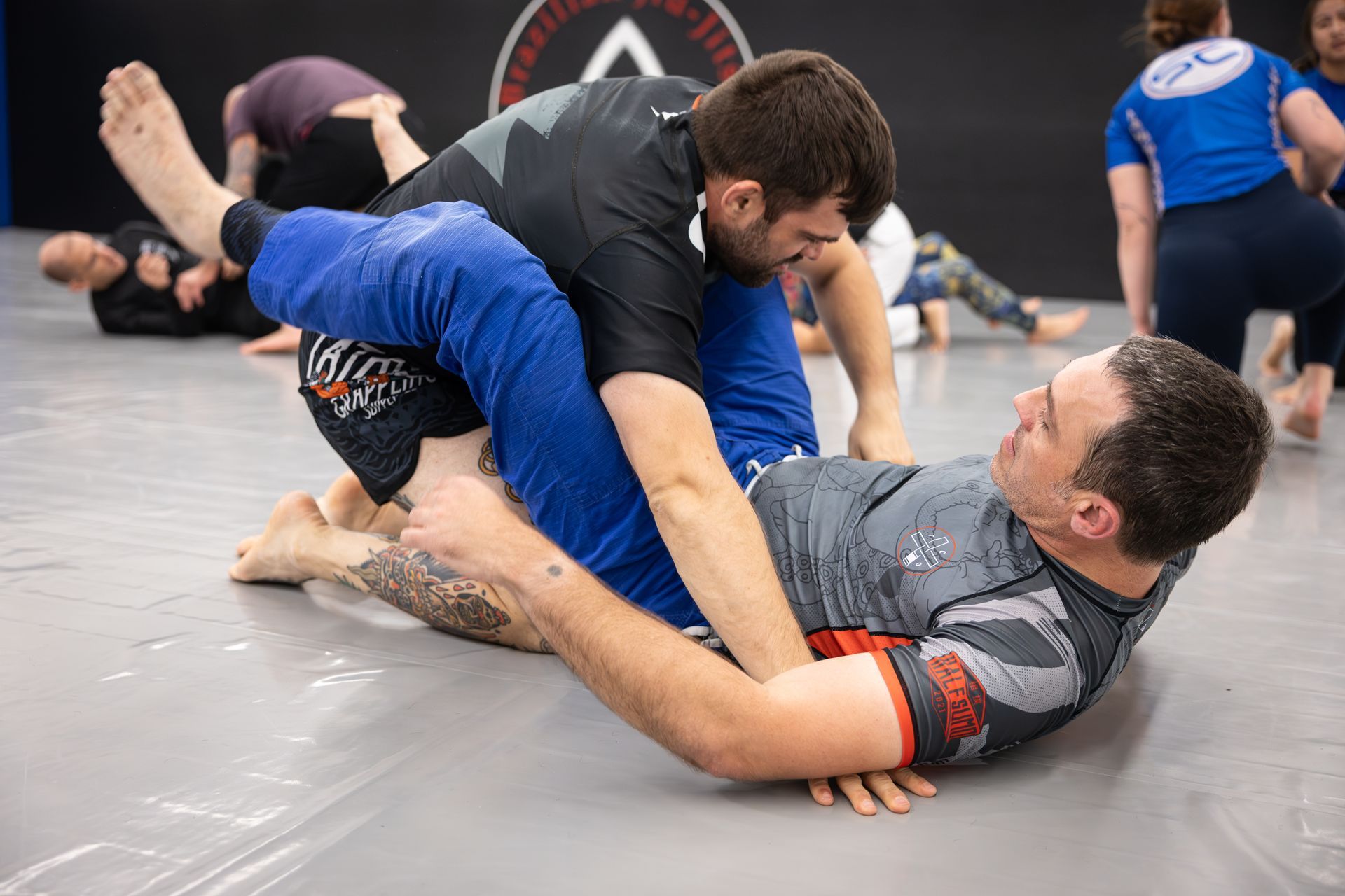 Adults drilling Jiu-Jitsu at Soulcraft Martial Arts in Hamden, CT, building calm focus and everyday resilience.