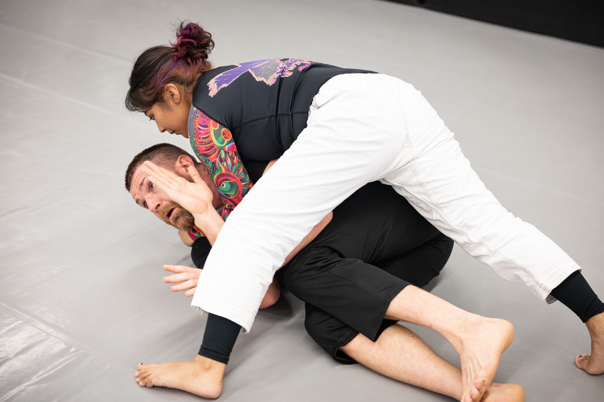 Adults drilling Brazilian Jiu Jitsu guard and escapes at Soulcraft Martial Arts in Hamden, CT for confidence and fitness.