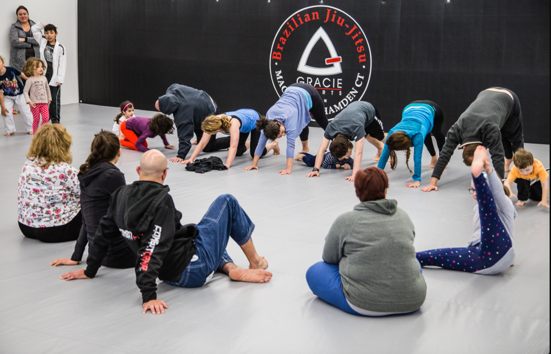 Adults practicing padwork in Muay Thai class at Soulcraft Martial Arts in Hamden, CT.
