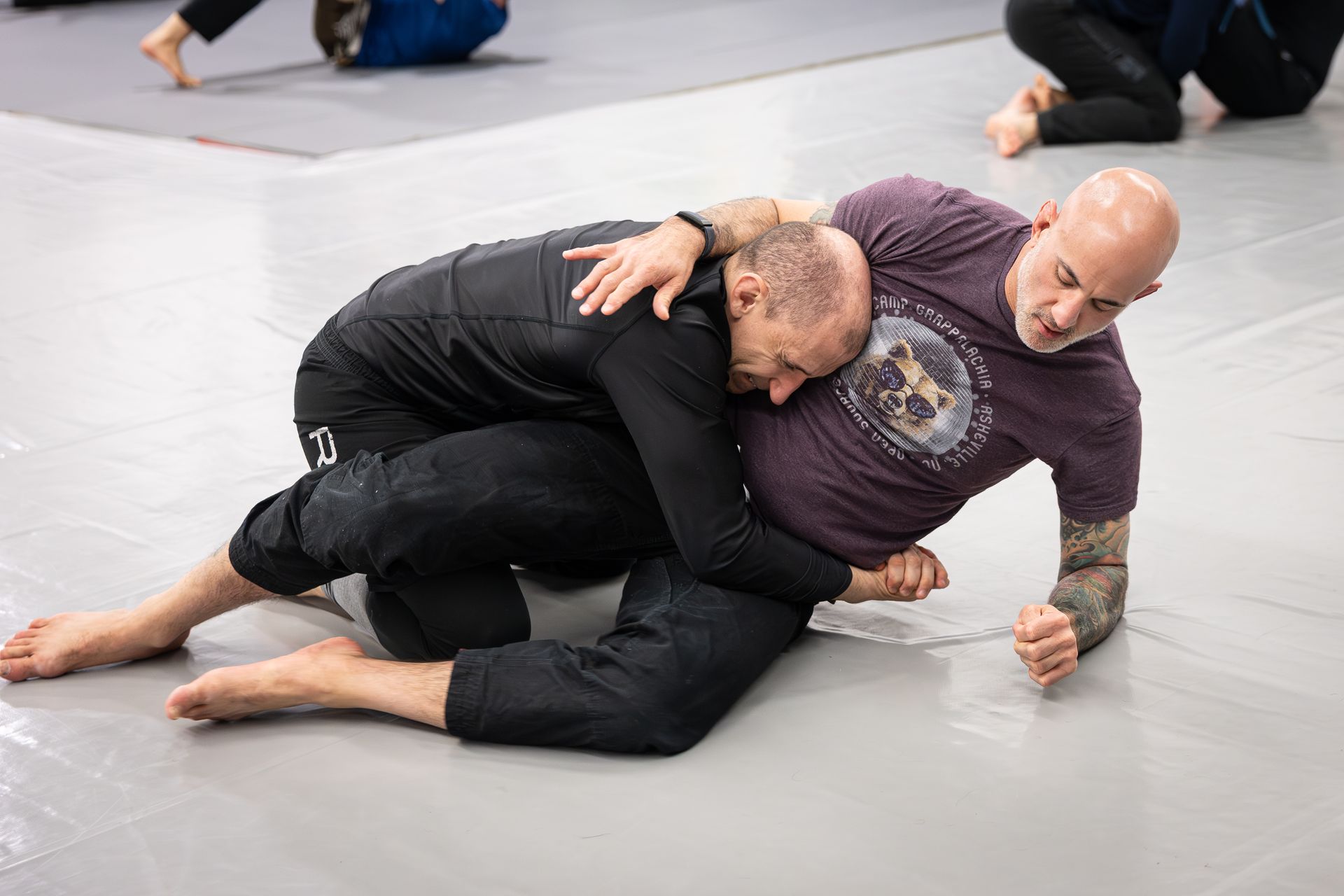 Adults drilling Brazilian Jiu-Jitsu technique at Soulcraft Martial Arts in Hamden, CT for fitness.