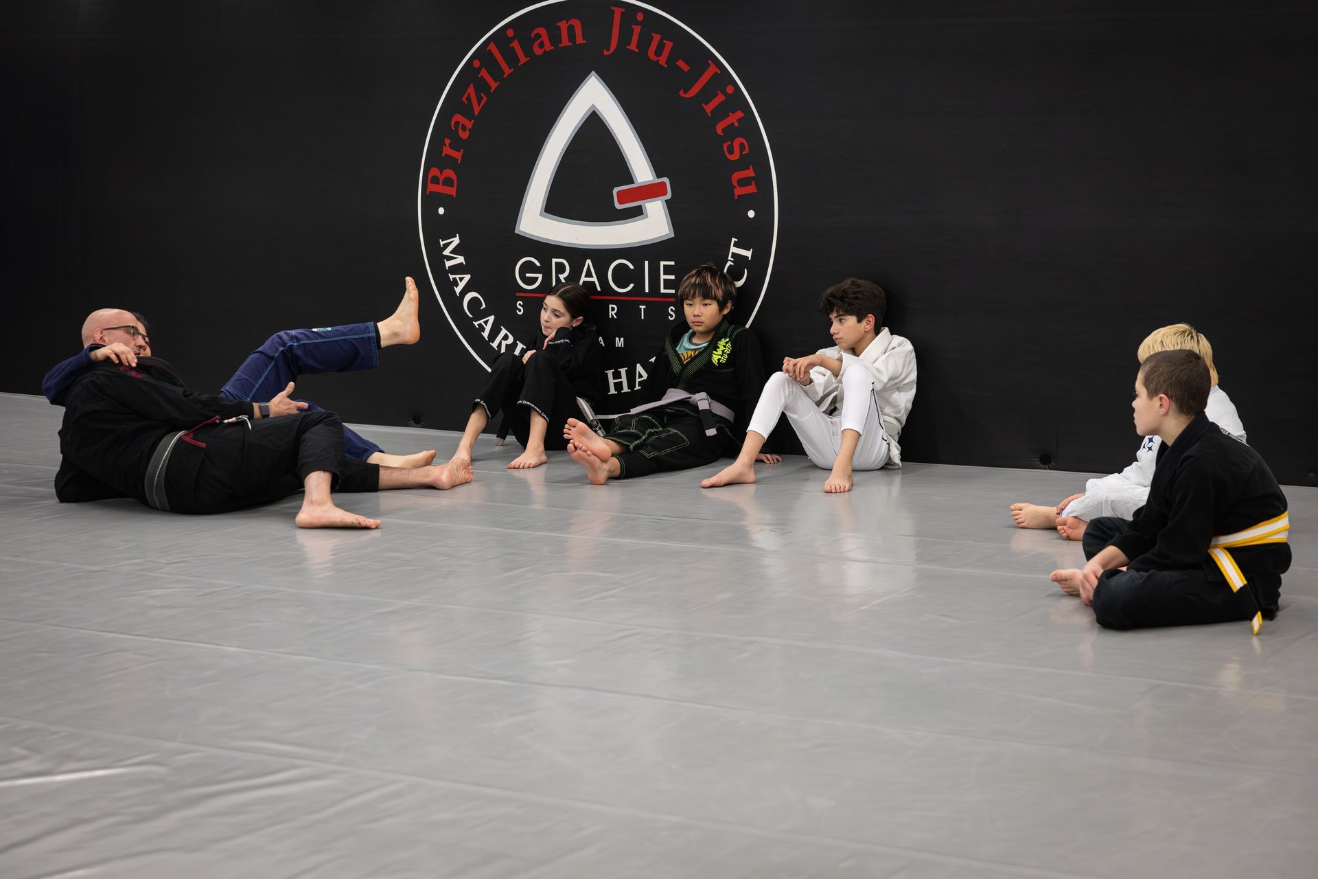 Kids practicing safe grappling drills at Soulcraft Martial Arts in Hamden, CT, building confidence.