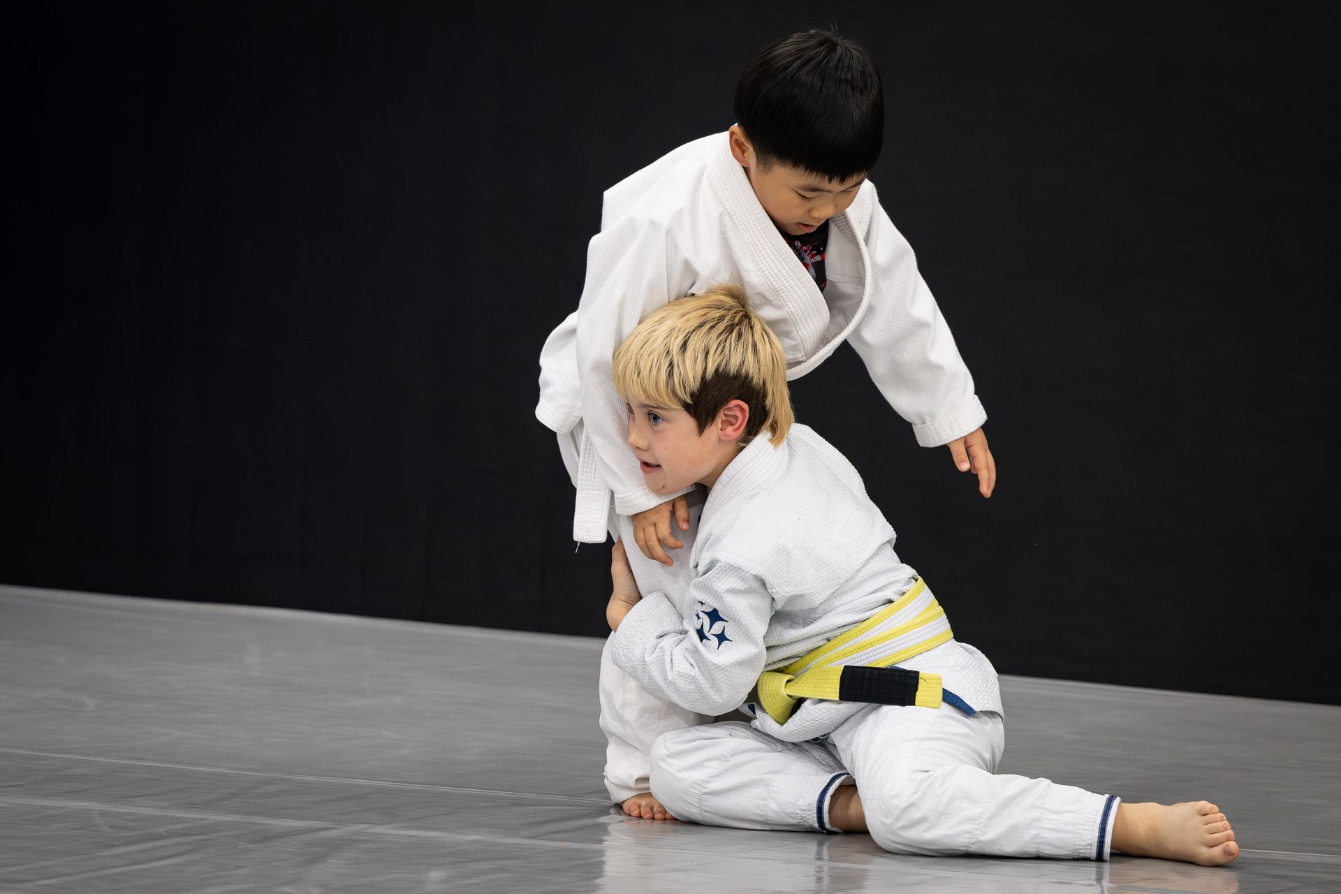 Kids drilling Youth Jiu-Jitsu with partners at Soulcraft Martial Arts to build friendships.