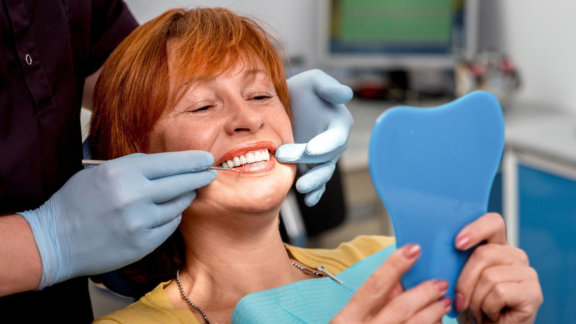 Patient Checking Her Dentures — Joelton, TN — Wingo Family Dentistry